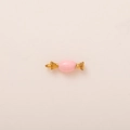 Macro shot of candy-shaped pink enamel pendant with 18K gold plated metal ends and loop - Pink Sweet Pendant