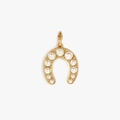Detailed macro of a horseshoe pendant with gold plating and gradient white pearls - Pearl Horseshoe Pendant