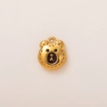 Close-up of golden bear charm with fine stitch texture and enamel eye details - Bear Pendant