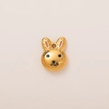 Detailed view of an 18K gold plated rabbit charm with pink ears and black facial features - Bunny Pendant