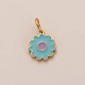Golden flower pendant with sky blue enamel petals and a purple center detail - Fresh Flower Pendant