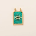 Macro detail of enamel evil eye tarot pendant with 14K gold plating and green finish - Blue Eye