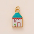 Macro shot of oval house-shaped pendant with blue roof and cactus oil painted detail - Multicolor Cactus House Style