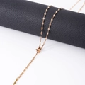 Detail of rose gold stainless steel leaf chain necklace on leather display stand - Lip Chain Rose Gold (2mm*40+5CM)