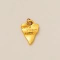 Detail of 18K gold heart pendant with Omnia Vincit Amor engraving and metal ring - Heart Letter Pendant