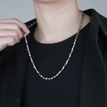 Polished silver stainless steel Mobius chain necklace for men shown on a model - Necklace / 50cm