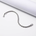 Detailed close-up of a twisted rope chain bracelet with a secure lobster clasp - 3.0mm*21cm / Steel