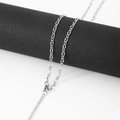 Close-up of silver Figaro chain necklace featuring polished stainless steel links on a black stand - 3mm (45cm+5cm) / Silver