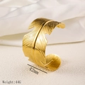 Detail of a 42mm wide gold feather cuff bracelet with detailed texture and 44g weight - Large Feather Design (Y01) / Gold