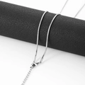 Detail of silver snake bone chain with lobster clasp and adjustable extension link - 0.9mm*55+5cm / Steel