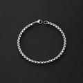 Close-up of polished silver stainless steel box chain bracelet with lobster clasp detail - Box Chain / Width 4 Length 21