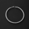 Detailed view of silver wheat chain texture and secure lobster clasp on black leather - Wheat Chain