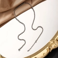 Detailed shot of silver bead chain necklace with lobster clasp on vintage mirror - Satellite Chain / 2.5mm / Steel / 45+5cm
