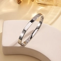 Polished silver stainless steel bangle with a minimalist design and hinge closure detail - 6mm Width / Steel