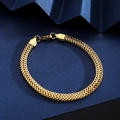Detail view of 18K gold plated stainless steel wheat chain with lobster clasp on blue background - Wheat Chain Bracelet - Gold (7mm Width)