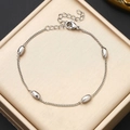 Close-up of polished silver beads on a minimalist stainless steel link chain with clasp - Steel Color Bracelet (17+5cm)