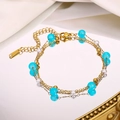 Detailed macro of a triple-layer gold bracelet with blue matte beads and white pearls - Blue Frosted Bead (Style 2)