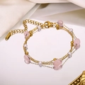 Detail of 18K gold-plated double-layer bracelet with rose quartz and pearls on a mirror - Pink Crystal Pearl (Style 6)