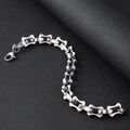 Close-up of silver-tone stainless steel H-link bracelet with a lobster clasp on black leather - 11.5mm Wide Steel Color