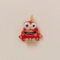 Dettaglio pendente mostro smaltato rosso con pois arancioni e papillon di strass - Stile Rana Rossa Smaltata