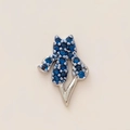 Fleur-de-lis pendant in silver finish with deep blue crystals on cream background - Fleur-de-lis Shape Charm / Dark Blue