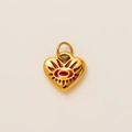 Detailed close-up of a gold heart pendant with red enamel evil eye and vacuum plating - Heart Evil Eye Pendant