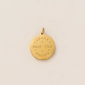 Detailed macro shot of a gold biscuit-shaped round pendant with rich tea biscuit engraving - Round Biscuit Pendant