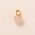 Detailed view of spherical rose quartz pendant with a polished gold bail attachment - Rose Quartz Pendant