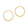 Detailed view of large gold hoop earrings with unique wave texture and polished finish - Gold Wavy Style (KE0997-2)