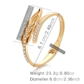 Modern gold plated irregular leaf bangle with inlaid crystals and open crossover design - Gold Double Leaf Cross Rhinestone Style (SZ60358)