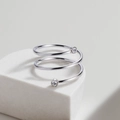 Macro shot of silver triple-layered spiral ring with zircon accents on stone base - US6 (Circumference 52mm) / Steel