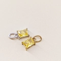 Detail of emerald-cut yellow zircon pendants in gold and silver plated settings - November Light Yellow - Silver