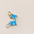 Detail of rectangular blue zircon pendants with gold and silver 14K plated settings - December Lake Blue - Silver