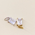 Detailed close-up of rectangle-cut birthstone pendants with gold and silver claw settings - April White - Silver