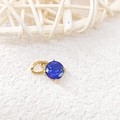Detailed macro view of 18k gold plated sapphire birthstone pendant for DIY jewelry - September Royal Blue - Gold