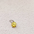 Classic yellow round zircon pendant with silver four-prong setting on white surface - November Light Yellow - Silver