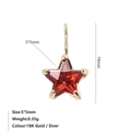 Macro shot of 5x5mm star-shaped red zircon pendant with 18k gold plated claw setting - January Red - Gold