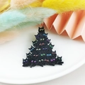 Macro view of a glittery black acrylic cat Christmas tree pendant with colorful eyes - Stacked Cat Tree (4)