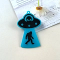 Blue acrylic UFO and Bigfoot charm pendant with black silhouette and hanging hole - Blue