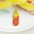 Cartoon enamel dragon charm with gold ingot and wealth symbols on red background - Get Rich Charm
