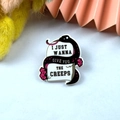 Gothic acrylic pin featuring a black snake and pink flowers on a white tombstone - Black Snake Wrapped Tombstone(2)