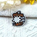 Detailed macro of acrylic ghost charm with Something Wicked This Way Comes text - Star Quote Style (3)