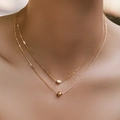 Double-layered 18K gold-plated necklace featuring a bean pendant and polished bead detail - 18K Gold / Oval Bead Style (KN0409)