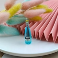 Miniature blue resin VSOP liquor bottle pendant with metal ring for DIY jewelry - Blue