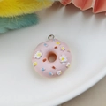 Pink resin donut pendant with white flowers and colorful sprinkles for DIY jewelry - Pink Floral Donut