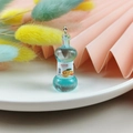 Blue resin miniature soda bottle pendant with orange label and silver metal ring accessory - Blue