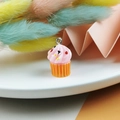 Miniature pink resin cupcake charm with colorful sprinkles and orange base for DIY crafts - Pink