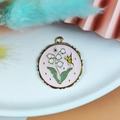 Pink enamel round pendant with lily of the valley and yellow butterfly for DIY jewelry - Round Butterfly