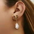 Elegant gold heart-shaped stud with white baroque pearl drop earring worn by model - 18K Gold / 3D Gold Heart Baroque Pearl Style (KE1526)