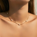 Elegant gold choker necklace featuring natural freshwater pearls worn by a model - Minimalist Fine Chain Pearl Necklace (KN0525)